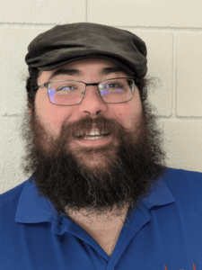 Photo of Dave Bianchi, A white male with dark hair and beard and glasses.